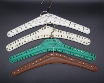 Vintage Clothes Hangers, 4 types and 3 colours with leather imitation and silver or gold colored studs from the 1960s