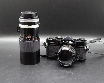 Vintage KONICA Autoreflex T with 2 Camera Lens The Konica Hexanon AR and TAMRON Auto f=200. Konica Made in Japan in the 60s