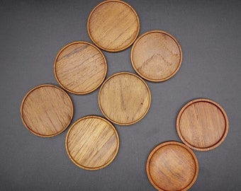 Vintage Karl Holmberg i Götene AB Coasters in Teak. Round coasters in two types. Made in Sweden in the 60s