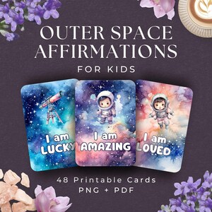 Może przedstawiać: Trzy karty afirmacyjne dla dzieci z motywem kosmicznym. Każda karta zawiera akwarelową ilustrację astronauty lub teleskopu na tle gwiezdnego tła. Karty głoszą "I am Lucky", "I am Amazing" i "I am Loved".