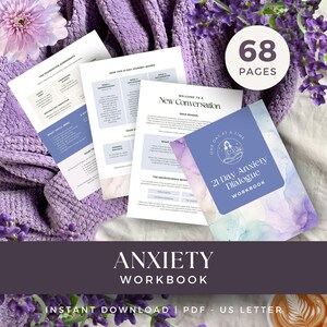 May include: A 68-page anxiety workbook featuring a purple cover with a watercolour design and the text 21-Day Anxiety Dialogue. The workbook includes multiple printed pages with headers like The Foundation Agreements and New Conversation.