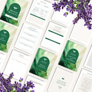 May include: A collection of open journals and pages with green and white accents, designed for burnout recovery. The cover reads "The Ultimate Burnout Recovery Journal." Lavender sprigs are in the corners.