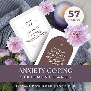 May include: Anxiety coping statement cards with the text "57 Anxiety Coping Statements". The cards are white with a grid pattern and brown accents. The image includes purple flowers and a lavender candle.