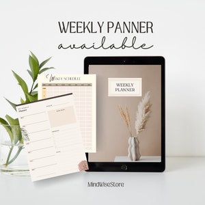 May include: A digital tablet displaying a weekly planner template with a beige background and a vase of dried pampas grass. The text "WEEKLY PLANNER" is displayed on the tablet screen. The text "WEEKLY PLANNER available" is displayed above the tablet.