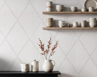 Papel pintado minimalista con diseño de rombos y mural geométrico escandinavo en gris suave.