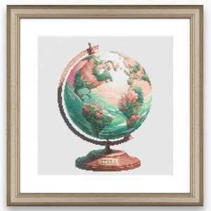 May include: A vintage-style globe with a green, blue, and pink world map on a wooden stand. The globe is surrounded by a white frame.