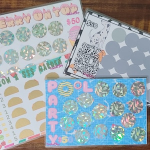 May include: Four colorful scratch-off cards with various designs. One card has the text "CHERRY ON TOP" and holographic circles. Another says "GROW A $$$ GARDEN" with taco graphics. A third card features a Dalmatian dog, and the last one says "POOL PARTY".