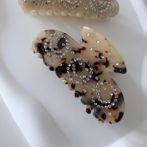 Our hair clips with smiley prints bring fresh joy to your hair styling. Browse now and experience the unique look!Hair clip