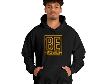 Be uncommon Unisex Heavy Blend™ Hooded Sweatshirt