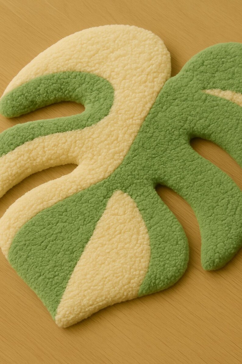 Minimalist tropical rug styled in entryway, variegated monstera leaf design.