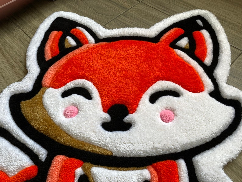 Vivid orange handmade fox rug close-up – soft tufted animal mat for playroom