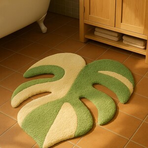 Handmade custom monstera rug, fluffy green and cream carpet for plant lovers.