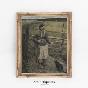 May include: A framed vintage print depicts a woman in a long coat and apron, standing near a wooden fence and a field. A black cat is in front of her. The print has a gold-colored frame and the text "Aesthetiqprints Printable Art" at the bottom.