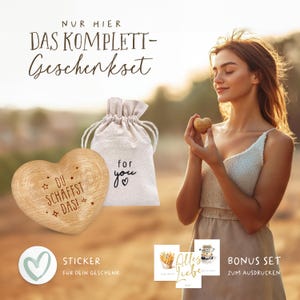 May include: A wooden heart with the text "DU SCHAFFST DAS!" and a small burlap bag with the text "for you" on it. The image also includes a sticker with a heart and the text "STICKER F&Uuml;R DEIN GESCHENK" and two printable cards with the text "Alles Liebe" and "BONUS SET ZUM AUSDRUCKEN".