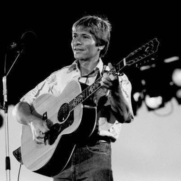 John Denver Performing Live on Stage