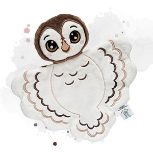 May include: A plush owl security blanket featuring a soft white body with embroidered brown and tan wing details. The owl head has a brown plush top, large embroidered eyes, and a small beak. A small white tag with the text "pipid" is attached.