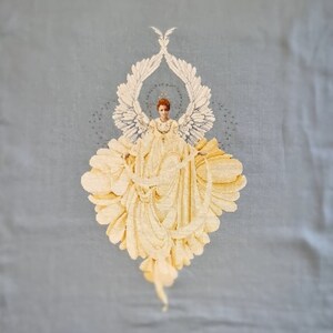 Refined cross-stitch painting depicting an angel of peace