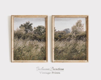 May include: Two framed landscape paintings with a vintage aesthetic. The paintings depict a field of tall grass and trees in the distance. The frames are a light wood color.
