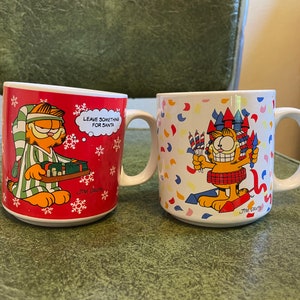 Vintage Garfield holiday mugs. Christmas and 4th of July. Garfield collector. Christmas Garfield