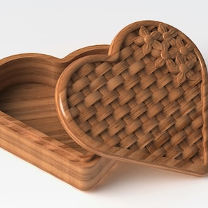 May include: A wooden heart-shaped box with a woven lid and carved flower details. The lid is open, revealing the empty interior of the box.