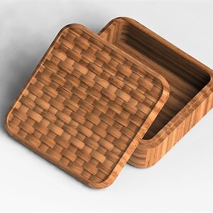 May include: A square wooden box with a woven lid. The box is made of light brown wood and has a natural finish. The lid is slightly ajar, revealing the empty interior of the box.