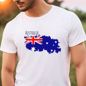 May include: White t-shirt with a blue and red Australian flag graphic and the word "Australia" printed on the front.