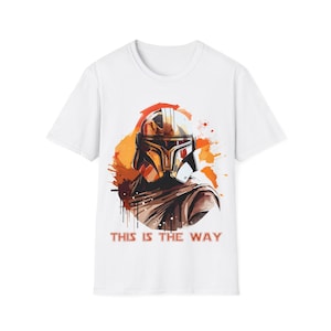 May include: White t-shirt with a watercolor-style image of a Mandalorian helmet and the text "This is the Way".
