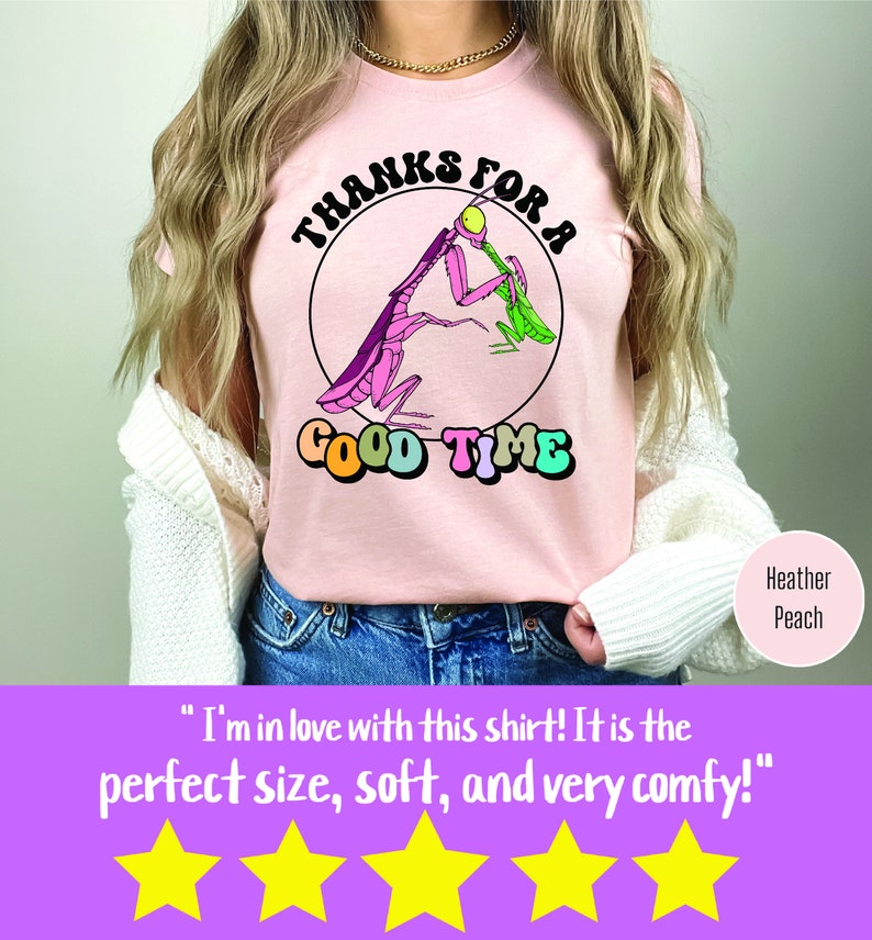May include: A pink t-shirt with a graphic of a praying mantis eating a green bug. The graphic is inside a circle with the text "Thanks for a Good Time" in rainbow colors.