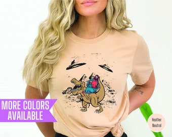 Jesus Riding Dinosaur UFO Graphic Tee: Novelty T-Shirt