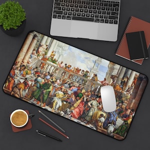 May include: A rectangular desk mat featuring a classical painting of a large gathering with many people. The artwork depicts a banquet scene with figures in colorful robes and architectural elements. A white computer mouse sits on the mat.