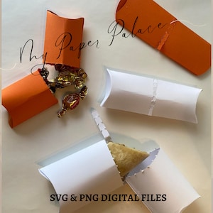May include: Four favor boxes, two orange and two white, with the text "My Paper Palace" and "SVG & PNG DIGITAL FILES". The orange boxes are folded open and one is filled with small wrapped candies.