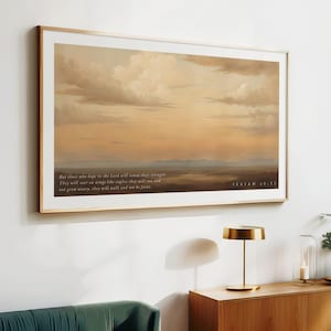 Peut inclure: Une impression encadrée avec une peinture d'un coucher de soleil sur un champ. L'impression comprend le texte "Mais ceux qui espèrent en l'Éternel renouvelleront leur force. Ils s'envoleront sur des ailes comme des aigles ; ils courront et ne se lasseront pas, ils marcheront et ne se fatigueront pas. ÉSAÏE 40:31"