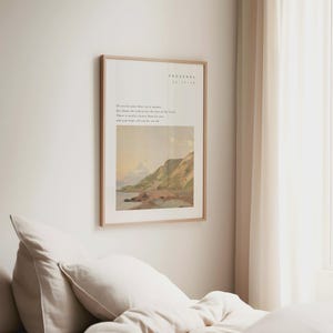 May include: A framed print with a light wood frame hangs on a white wall. The print features text at the top and a landscape painting of a coastal scene. The text reads "PROVERBS 12:17:19". The painting depicts a beach, cliffs, and a cloudy sky.