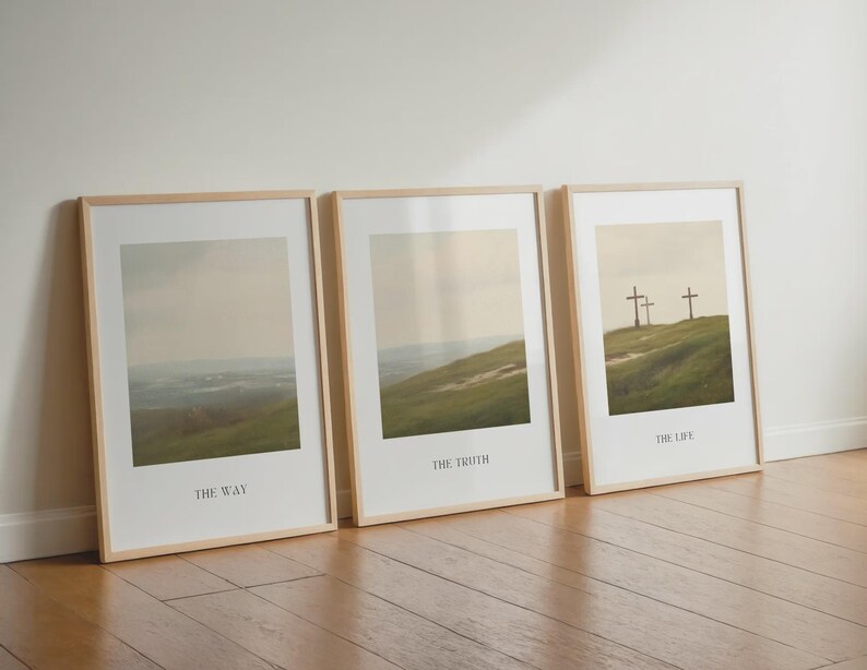 May include: Three framed art prints with landscape scenes. Each print has a light wood frame and features a different image of a grassy hill with a cloudy sky. The text "THE WAY", "THE TRUTH", and "THE LIFE" are printed at the bottom of each print.