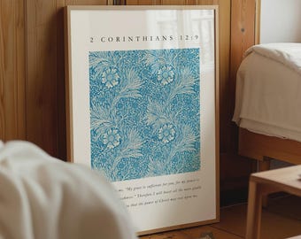 May include: A rectangular wall art print in a light wood frame featuring a blue and white floral pattern. The text 2 CORINTHIANS 12:9 is printed at the top, and a passage of scripture is printed in small black font at the bottom of the white border.