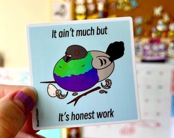 May include: A sticker with a cartoon pigeon with a green, purple, and blue shell. The text on the sticker reads "It ain't much but it's honest work".