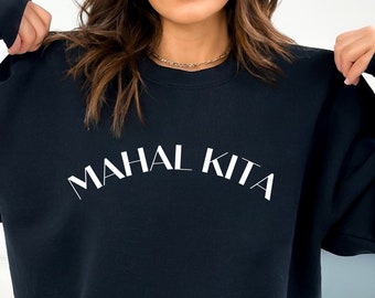 May include: Black sweatshirt with the text "MAHAL KITA" in white.