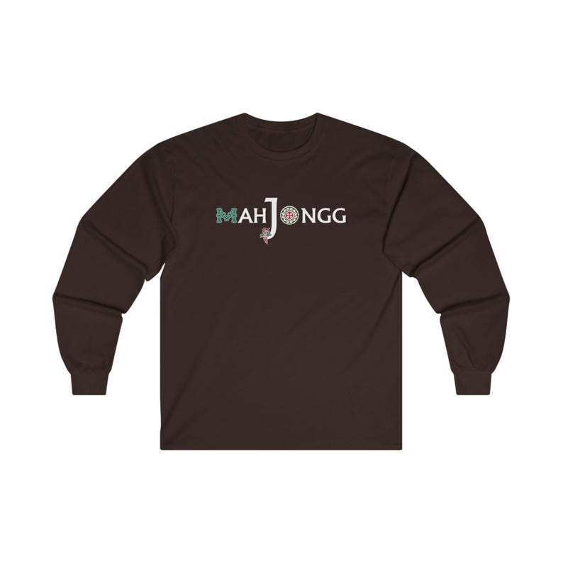May include: A dark brown long-sleeved t-shirt with the text "MAH JONGG" printed in white on the front. The text is styled with a green and blue design.