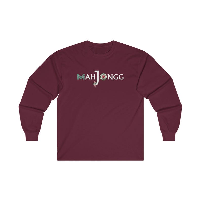 May include: A maroon long-sleeved t-shirt with the text "MAH JONGG" in white with a green and blue design.