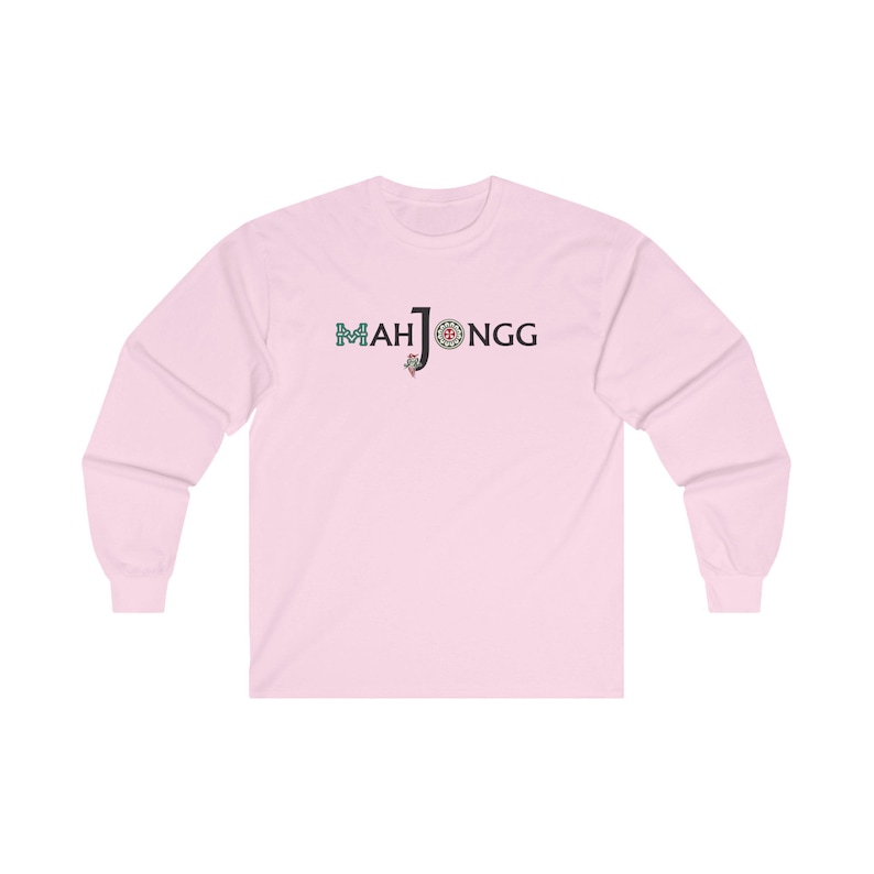 May include: A pink long-sleeved t-shirt with the text "MAH JONGG" in black letters and a colourful mahjong tile graphic.