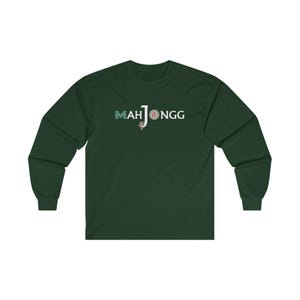 May include: A dark green long-sleeved t-shirt with the text "MAH JONGG" in white letters with a green and white design.
