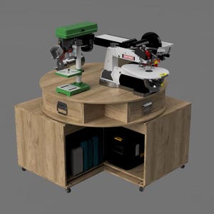 May include: A wooden workshop table with a green drill press and a white and black scroll saw. The table has drawers and a cabinet with storage. The table is on wheels.