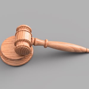May include: A wooden gavel with a brown handle and a round base. The gavel is lying on its side with the handle extending to the right.