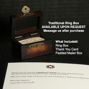 May include: A dark wooden ring box with a hinged lid and brass hardware. The box is open, revealing a beige fabric interior. Text on the image reads "Traditional Ring Box" and "What Included: Ring Box, Thank You Card, Padded Mailer Box."