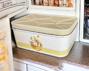 Panera metálica vintage de los años 40: diseño de espigas de trigo amarillas y blancas.