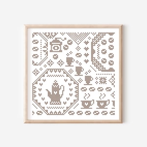 May include: A framed cross-stitch pattern featuring a brown teapot, coffee cups, and coffee beans. The design is a simple, geometric pattern with a white background.