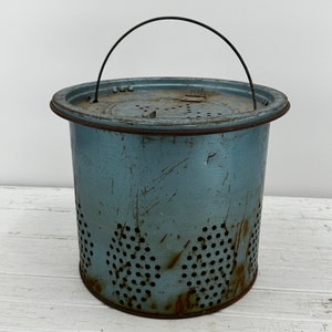 vintage blue metal minnow bucket. Star design