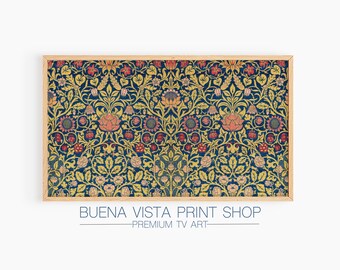May include: A framed print of a vintage floral pattern with a blue background, yellow leaves, and pink and red flowers. The print is framed in a light wood frame. The text "BUENA VISTA PRINT SHOP - PREMIUM TV ART" is below the frame.