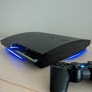 Refurbished Sony PS3 Slim 1TB Full CFW Custom Blue LEDs + New Thermal Paste + New Thermal Pads + OEM Controller + Cords + Clean + Tested