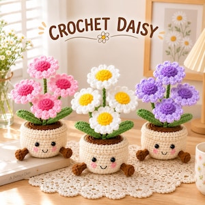 May include: Three crochet daisy plants in cream-colored pots with smiling faces, pink cheeks, and small brown feet. The flowers feature pink, white, and purple petals with yellow or matching centers, green stems, and leaves. Text reads CROCHET DAISY.